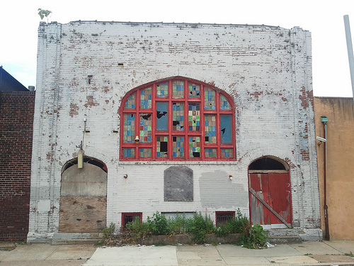 Picture of Old Church with Broken Stained Glass Facade